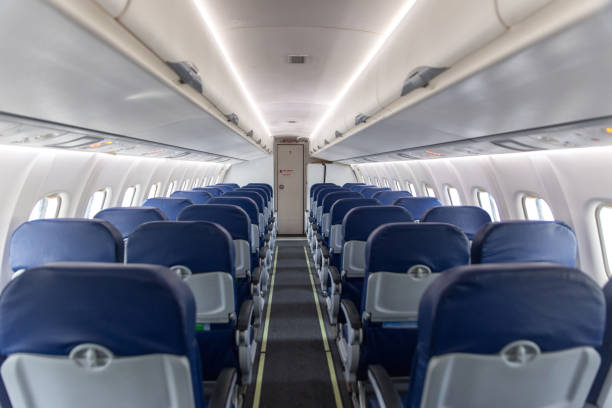 empty interior of the passenger aircraft In a pandemic, airplanes often fly empty - inside plane plane hand tool photos stock pictures, royalty-free photos & images