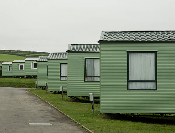 Caravans a row of caravans on a english campsite. summer resort stock pictures, royalty-free photos & images
