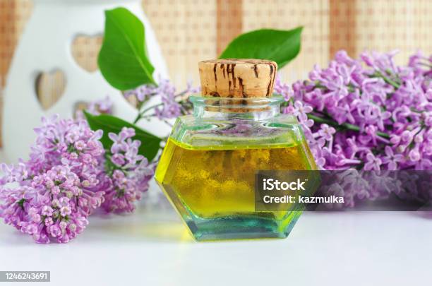 Vintage Bottle With Cork With Essential Oil And Lilac Flowers Aromatherapy  Natural Skin Care Homemade Spa And Herbal Medicine Ingredients Stock Photo  - Download Image Now - iStock
