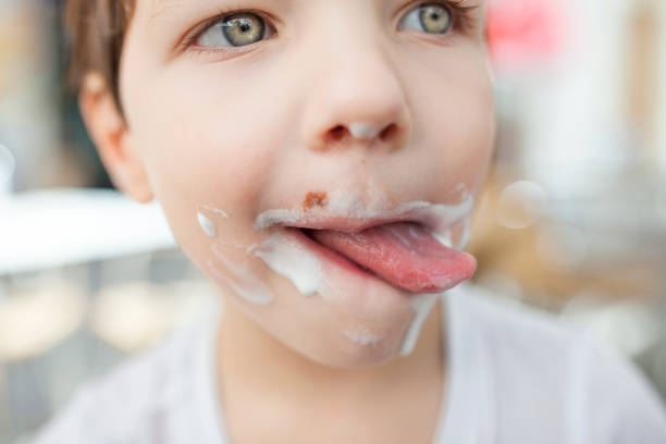 istock 4 years old boy enjoying a stick ice cream 1246267593
