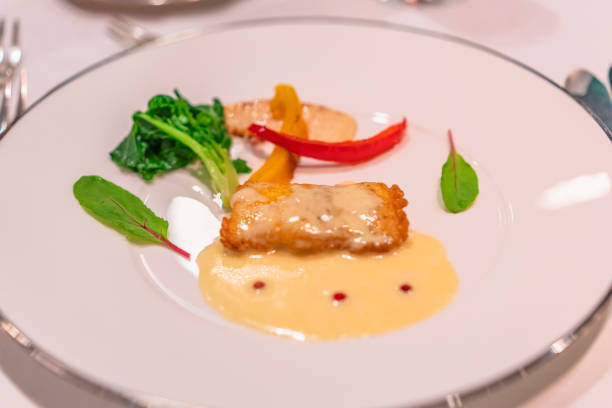 istock French dish on a silver rim white dinner plate. 1246284548