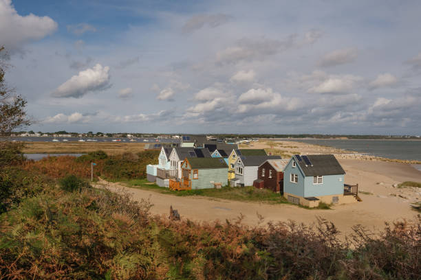 Beach Huts on the Spit Beach Huts at Hengistbury Head Spit. hengistbury head photos stock pictures, royalty-free photos & images