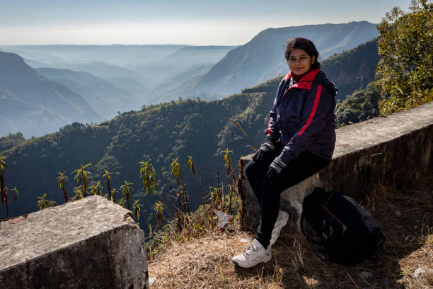 istock girl watching the pristine nature at mountain range covered with white mist 1246286266
