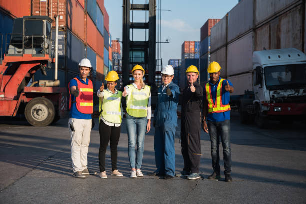 istock Group of foreman man & woman worker working checking at Container cargo harbor to loading containers. Dock male and female staff business Logistics import export shipping concept. 1246295121