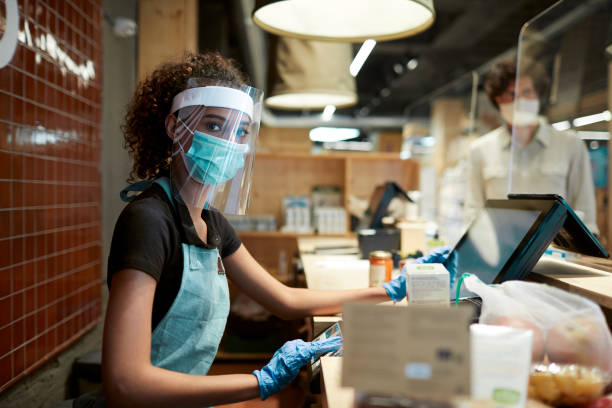 istock A grocery's cashier protected against COVID19 1246295212