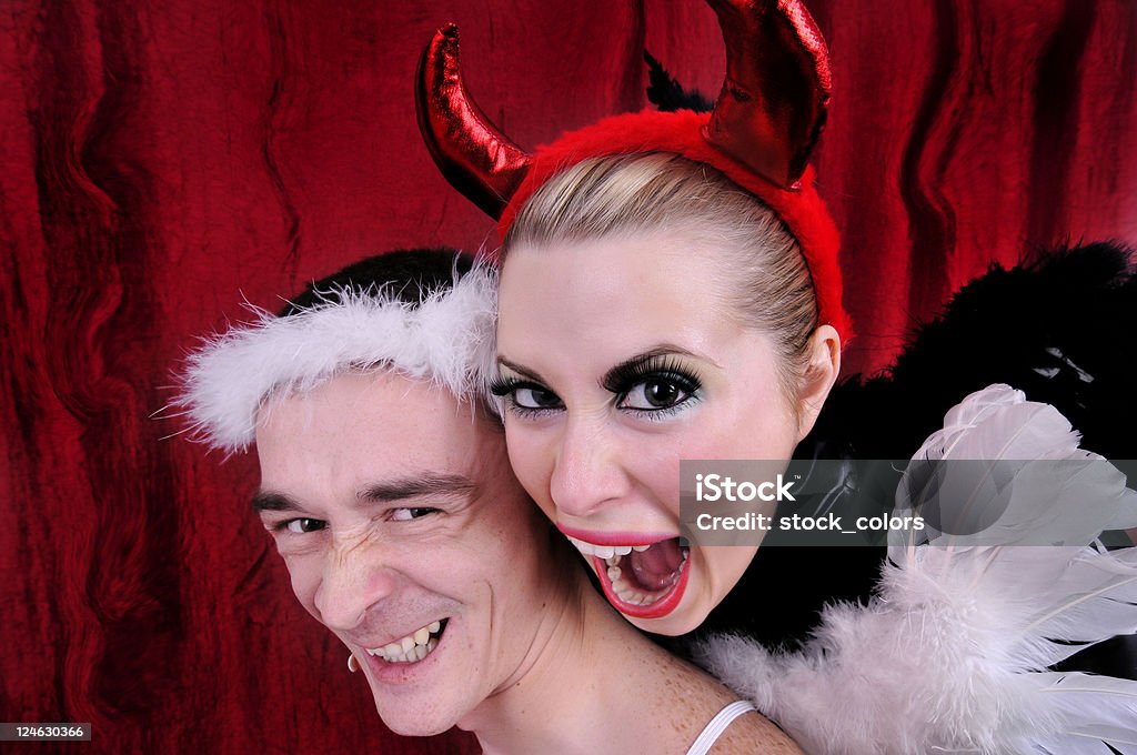 angel and devil angel and devil fighting and being angry. Adult Stock Photo