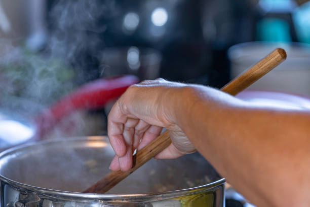 istock Stirring the risotto rice in the pan with hot water. 1246306986
