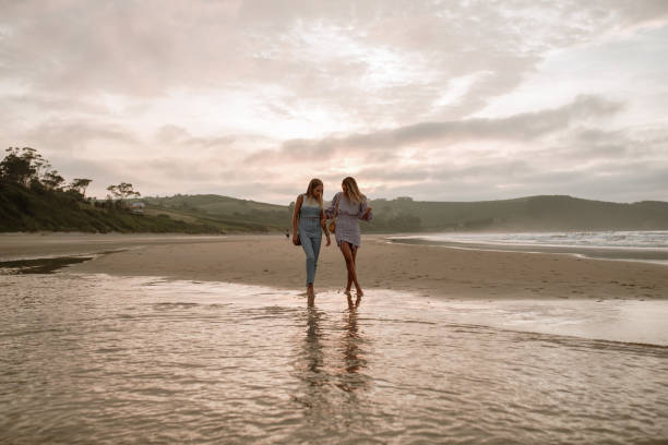 istock Two young women having fun at the beach 1246308689