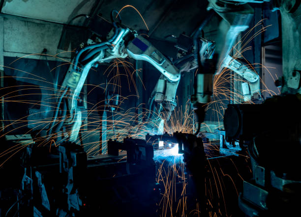 istock Welding robots movement in a car factory 1246319370
