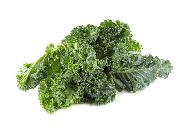istock Fresh organic green kale leaves isolated over white background 1246330447