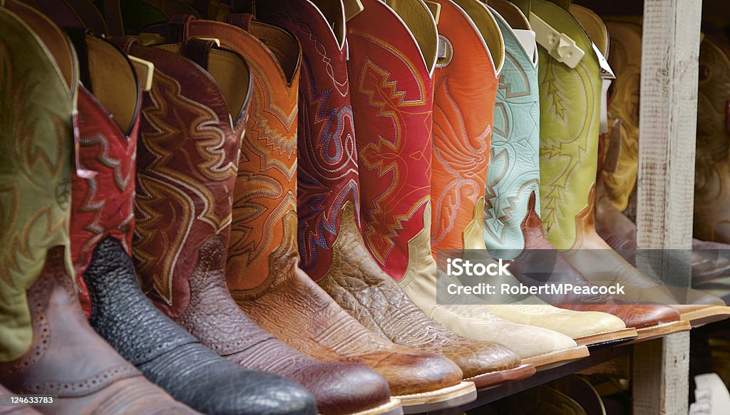 Texas Boots A row of boots sits for sale in a Dallas, TX western wear store. Shot with Canon EOS 5D. Dallas - Texas Stock Photo