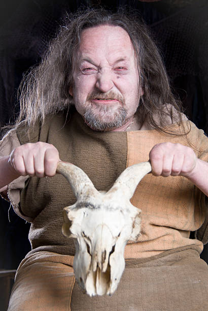 istock Crazy old man holding Goats skull 124635625