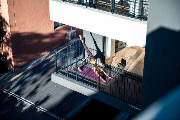 istock Yoga routine at the balcony. 1246358882