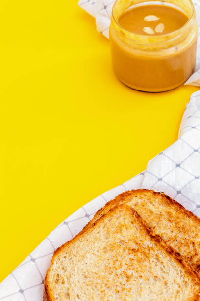 Appetizing peanut paste butter sandwich. Close up.