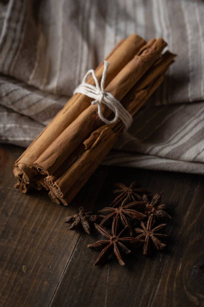 istock cinnamon and star anise on wooden background 1246363029