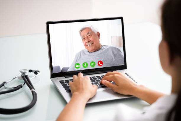istock Doctor Talking To Male Patient Through Video Chat 1246363232