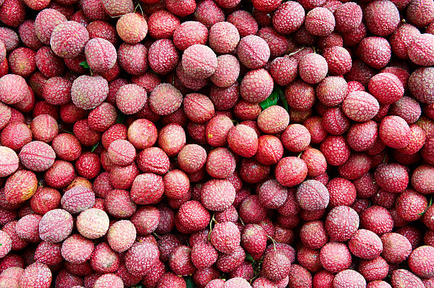 Ripe Lychees Background  lychee stock pictures, royalty-free photos & images