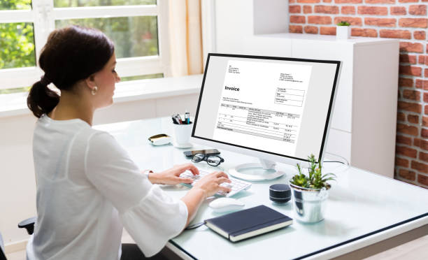 istock Young Woman Doing Online Invoice Management 1246366624