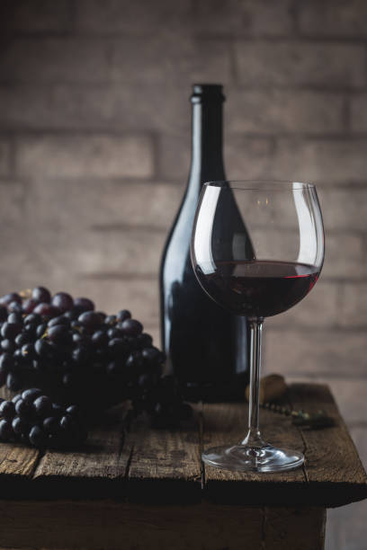 istock Red wine and ripe grapes 1246368339