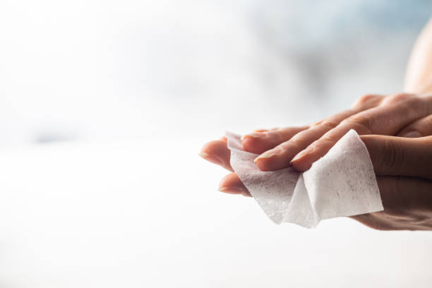 istock Woman hands with wet wipe 1246368897