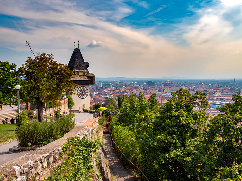 View on the famous Uhrturm on the Schlossberg circa August 2019 in Graz, Austria.