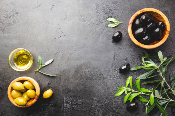 istock Black olives and olive oil 1246371303