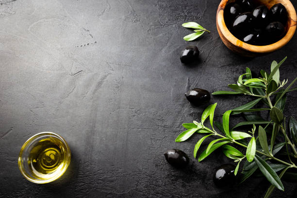 istock Black olives and olive oil 1246371306