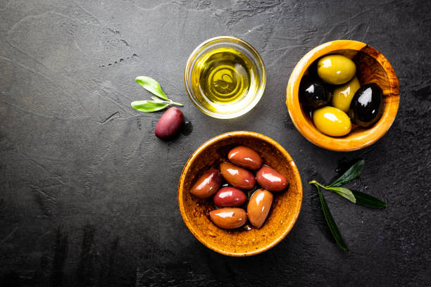 istock Black and green olives 1246371316