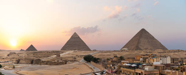 istock Giza live district in front of the Great Pyramids,Cairo, Egypt 1246380414