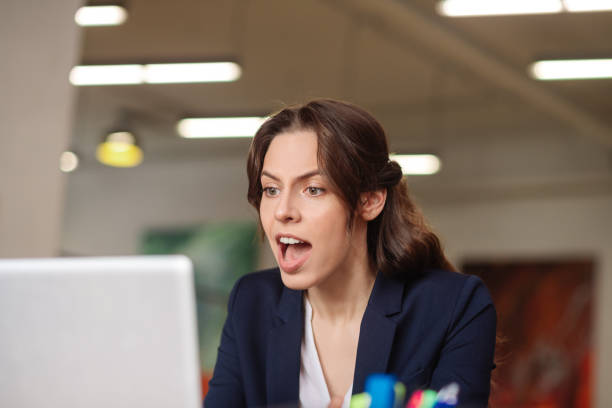 istock Serious girl talking convincingly on a laptop. 1246395350