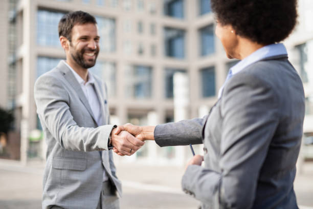 istock Business people shaking hands. 1246401795
