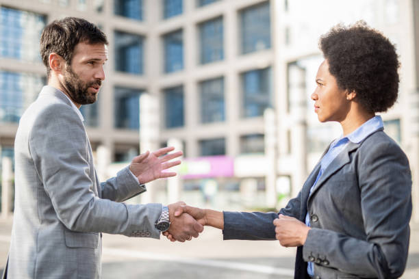 istock Business people shaking hands. 1246404047