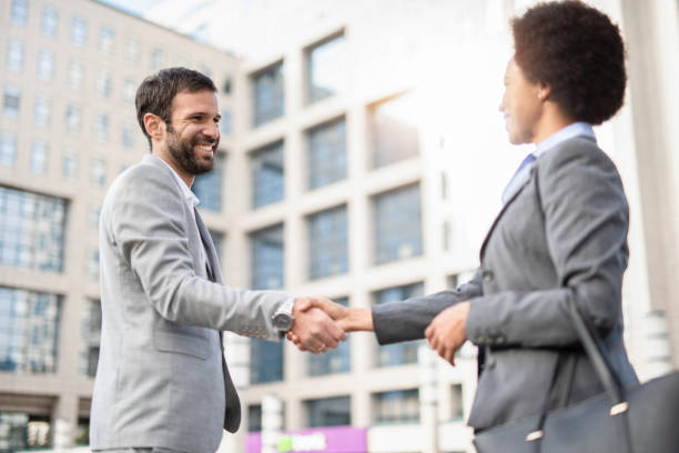 istock Business people shaking hands. 1246409545