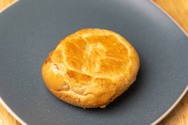 istock close up round bread in blue plate 1246433090
