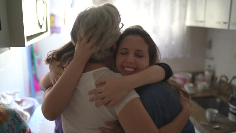 Family girls embracing at home