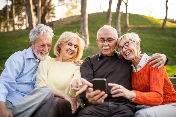 istock Group of seniors using mobile phone. 1246442896