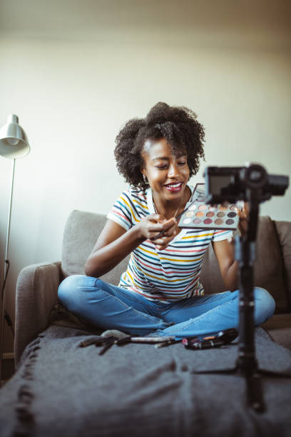 istock Beautiful African-American woman beauty vlogger recording makeup tutorial 1246442969