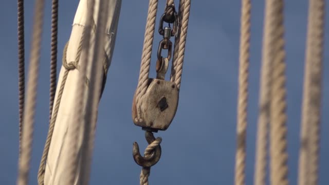 Hook and hand rope hoist on the deck of an old traditional ship.