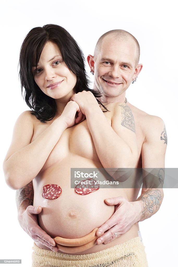 Grávida mulher e homem segurando um sorriso - Foto de stock de Grávida royalty-free