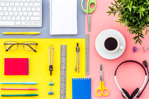 istock Education Online School Concept. Keyboard, stationery on colorful desk top-down flat lay pattern 1246451970