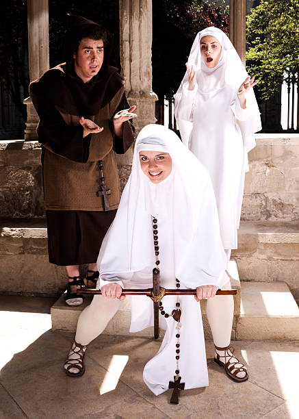 This nun just wants to have fun Young nun having fun whilst another nun and monk look in horror. angry nun stock pictures, royalty-free photos & images