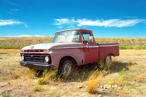 Seemingly abandoned pickup truck in farmer's field in Wyoming.