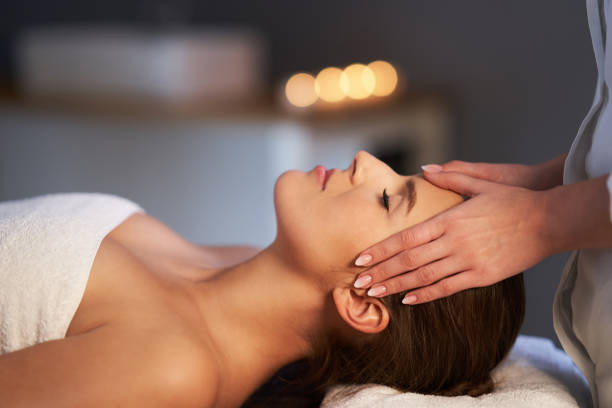 istock Relaxed woman receiving head massage 1246465444