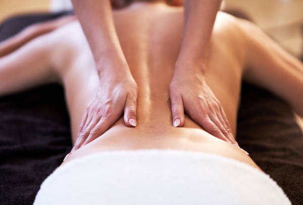 istock Relaxed woman receiving back massage 1246467454