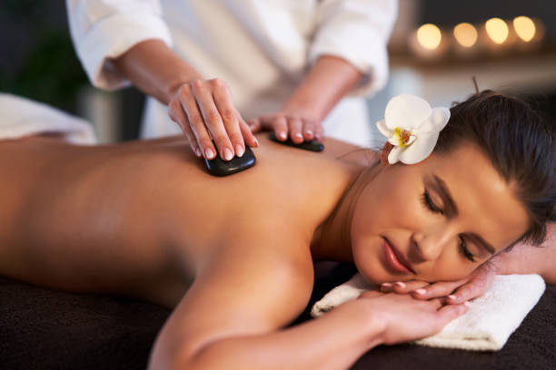 istock Relaxed woman receiving stone back massage 1246468542