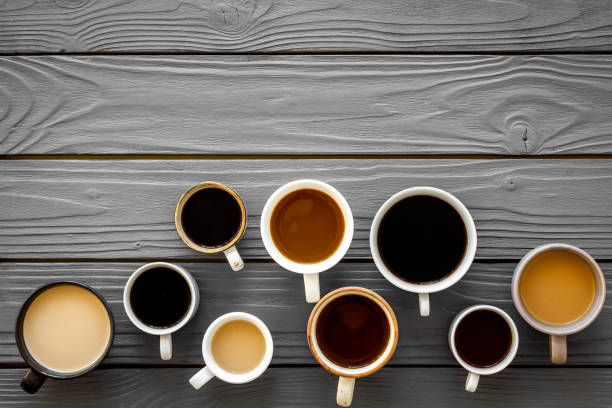 istock Lots of coffee on wooden table top view copy space 1246468552