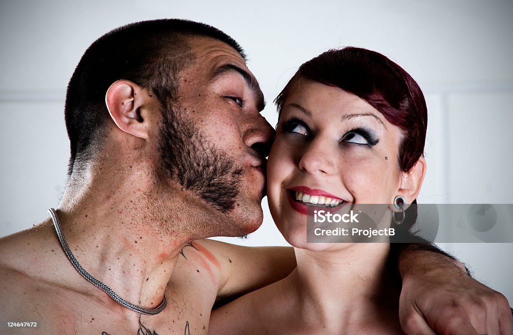 Young couple kissing Heavily in love young couple kissing. Sideburn Stock Photo