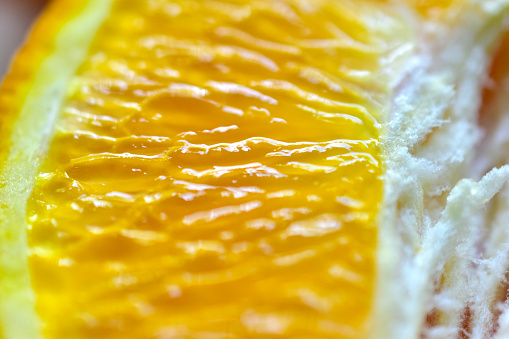 Flesh of a ripe yellow orange close up