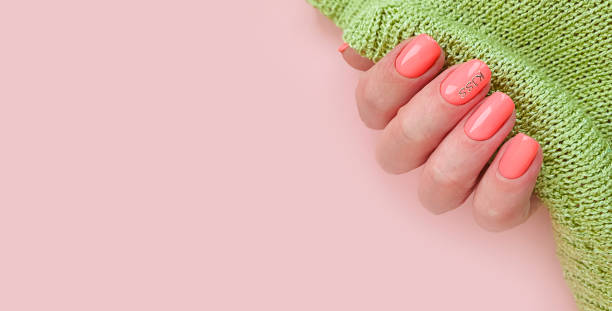 istock female hand nail beautiful manicure sweater 1246475869