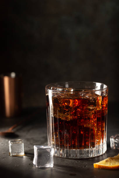 istock Glass of cola with ice 1246480263